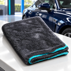 AI-assisted illustrative view of one folded Hydrolock towel on a clean counter in a detailing bay